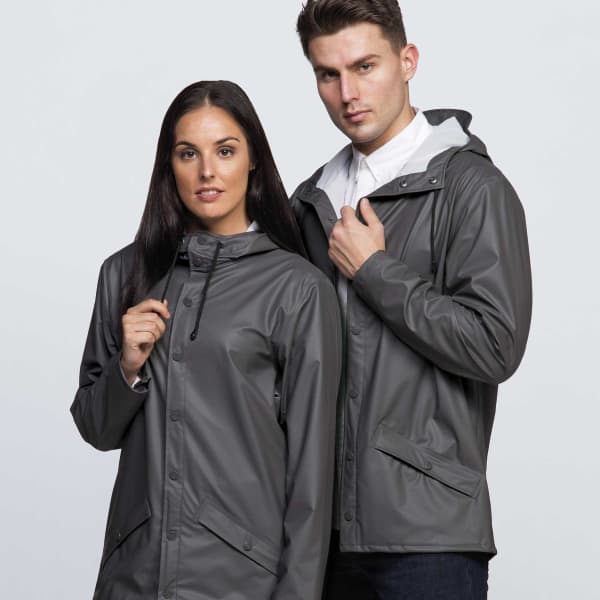 A grey rain jacket featuring a hood, worn by two models, with a subtle logo on the jacket.