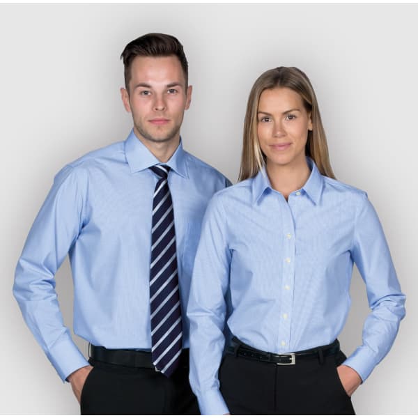 A light blue button-up shirt for women, featuring a classic collar and a branded logo.