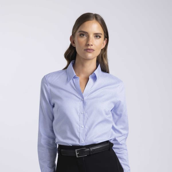 A blue and white checked women's button-up shirt with a collared neckline and long sleeves. Features a logo.
