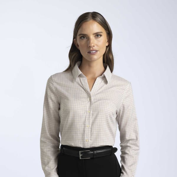 A women's check shirt in beige and white with a collar and button-down front, featuring a branding logo.