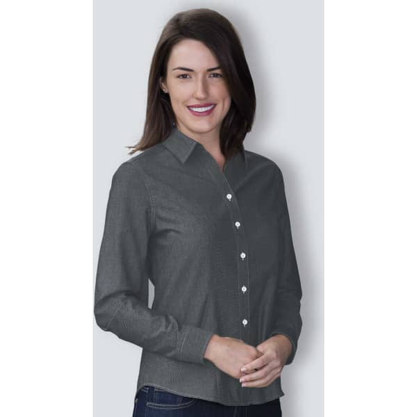 A woman models a women's button-up shirt in grey chambray fabric, featuring a collared neckline and button front.