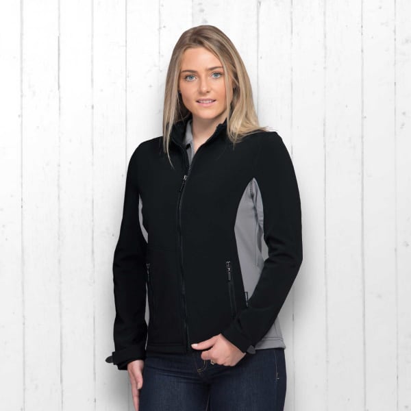 A black and grey soft shell jacket with a zip front, featuring side pockets and a logo.