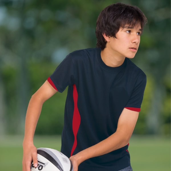 A navy blue t-shirt with red accents and a logo, designed for youth sports activities, featuring a young person holding a rugby ball.