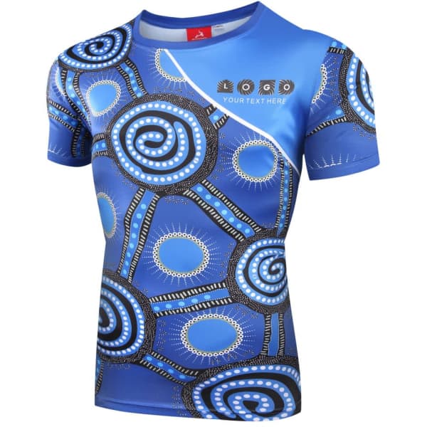 A sublimated t-shirt featuring a blue design with circular patterns and a logo on the front.