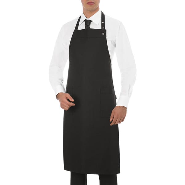 A black apron worn by a person in a white shirt and tie, featuring a pocket and a logo.
