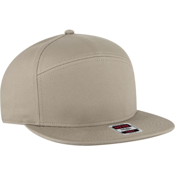 A beige mid-profile mesh back trucker snapback hat featuring a flat brim and a logo patch on the front.
