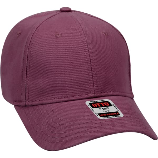 A low-profile 6 panel baseball cap in a muted burgundy colour with a branded tag.