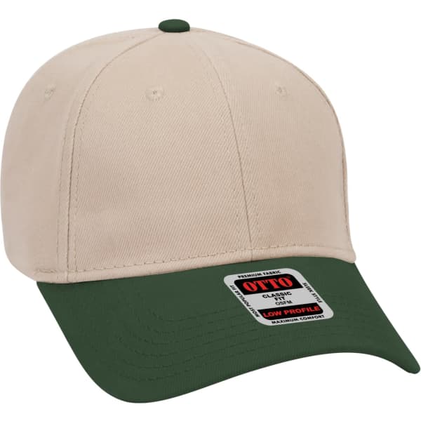A beige 6 panel baseball cap with a green peak and a branded tag attached to the side.