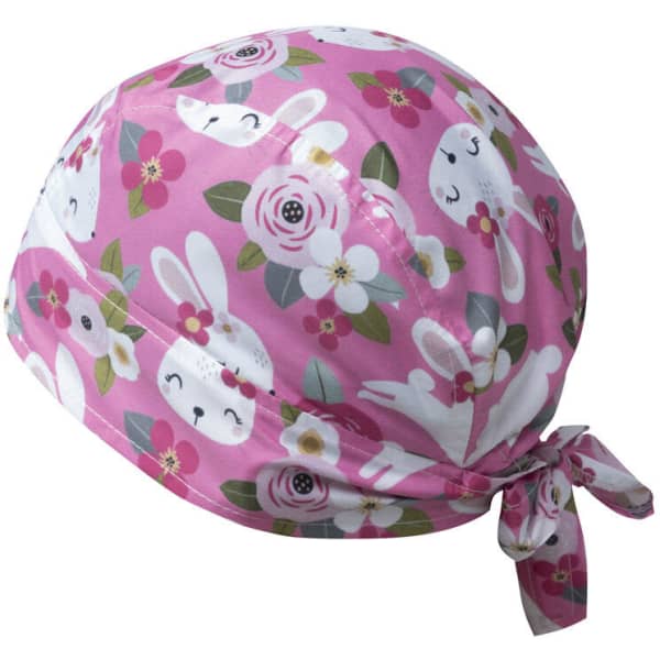 A pink bandana with a floral pattern featuring bunnies, tied at the back. It has a logo on it.