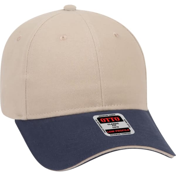 A beige baseball cap with a navy blue peak and a logo on the side. Designed as a low-profile style.
