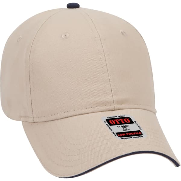 A beige 6 panel baseball cap with a low-profile design and a contrasting dark peak, featuring a logo.