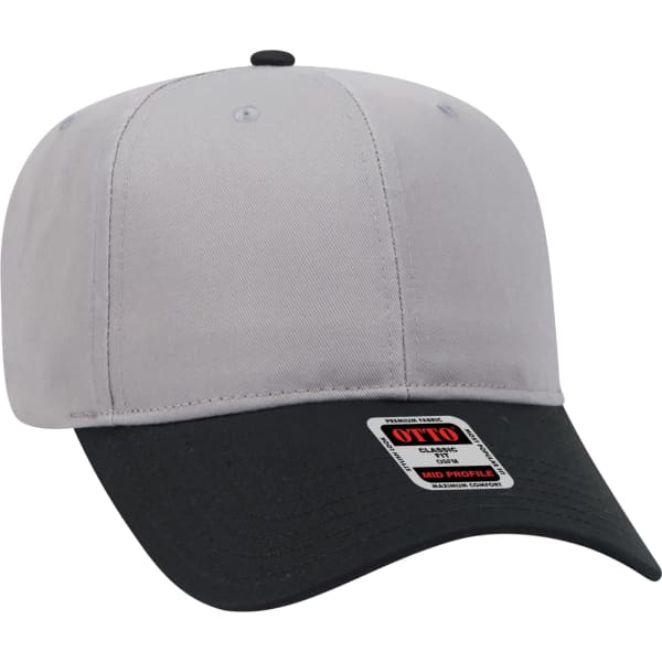 A grey and black 6 panel baseball cap featuring a curved peak and a branding label on the side.