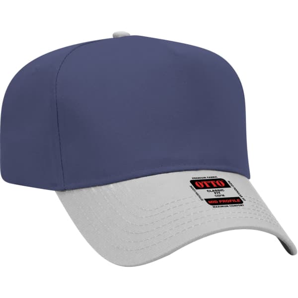 A 5 panel baseball cap featuring a navy blue crown and a grey brim. It includes branding on the side.