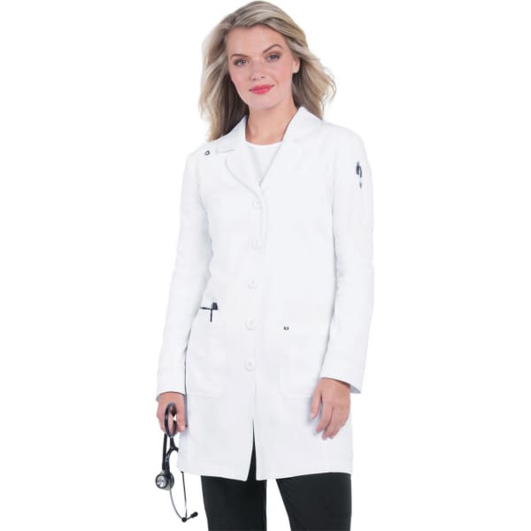 A fitted white lab coat with button closure and side pockets, modelled by a woman with long hair.