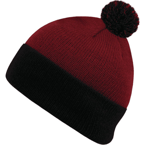 A red and black pom pom beanie with a knitted design and a fluffy pom pom on top.