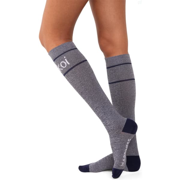 Compression socks in grey with navy detailing, featuring a logo. Designed to reach just below the knee.