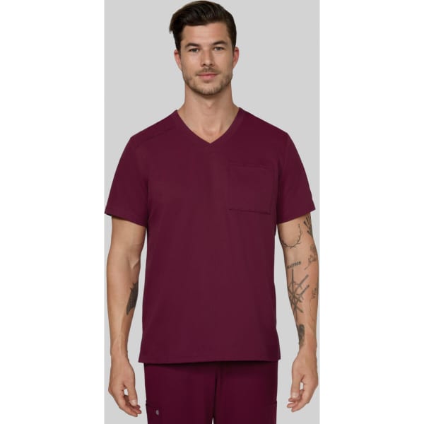 A scrub top in a rich burgundy colour, featuring a V-neck design and a chest pocket, worn by a male model.