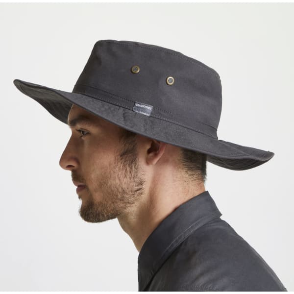 A black Kiwi ranger hat featuring a wide brim, with a logo, displayed on a model's head in profile.