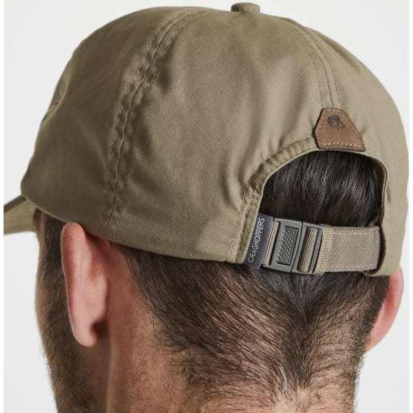 A green trucker cap featuring a rear adjustable strap and a logo at the back.