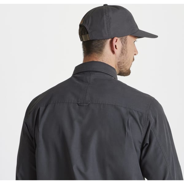 A grey trucker cap is worn by a person facing away, paired with a matching grey shirt. The cap has a logo.