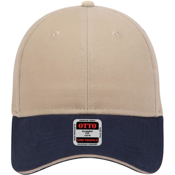 A beige and navy six-panel low profile baseball cap with a logo tag on the front.