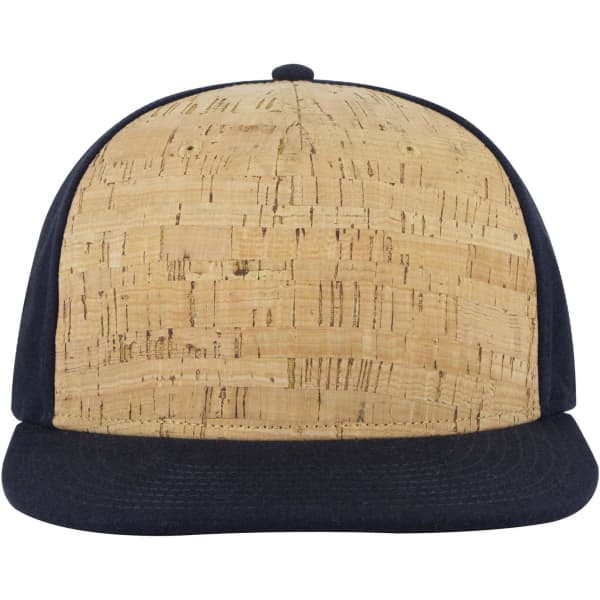 A 5-panel snapback cap featuring a textured natural cork front and a navy blue fabric brim.