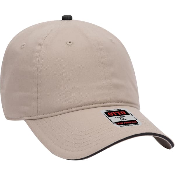 A beige 6 panel low profile baseball cap with a black accent and a logo on the side.
