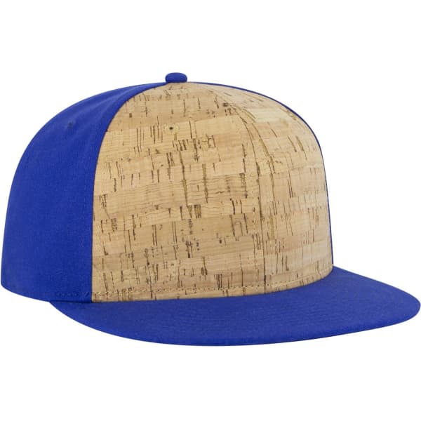 A six-panel mid profile snapback cap featuring a cork front and a blue fabric back, with a solid blue visor.
