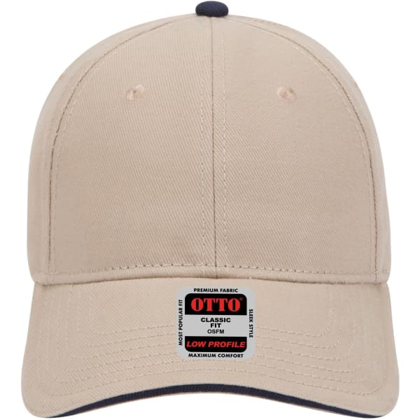 A beige 6 panel low profile baseball cap featuring a dark navy undervisor and a branded label.
