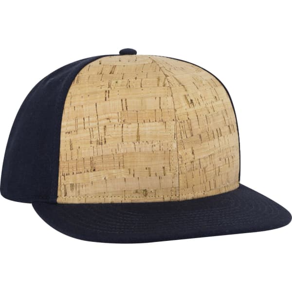 A mid-profile snapback cap featuring a cork design with a navy blue brim and underside. Includes a logo.