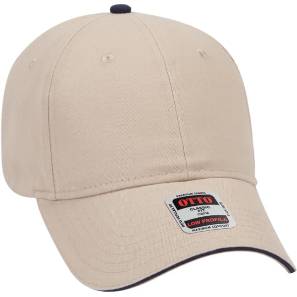 A beige low profile baseball cap with a dark peak and a branding label on the side.