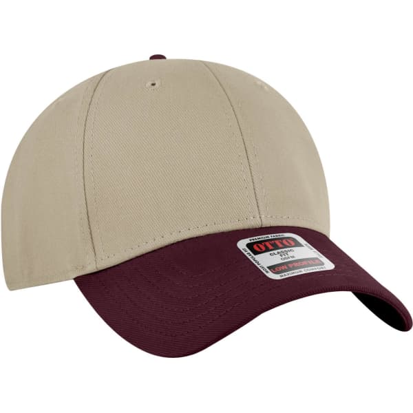 A beige and burgundy six-panel low profile baseball cap featuring a logo on the front.