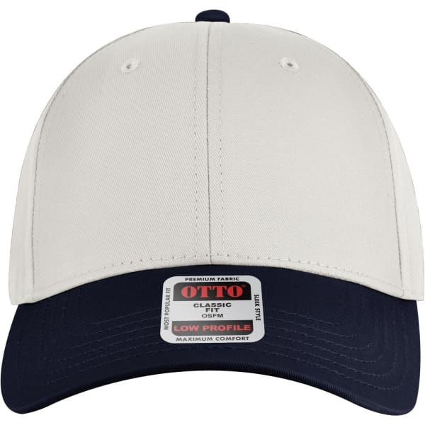 A low profile baseball cap featuring a cream upper and a navy peak, with a logo on the front.