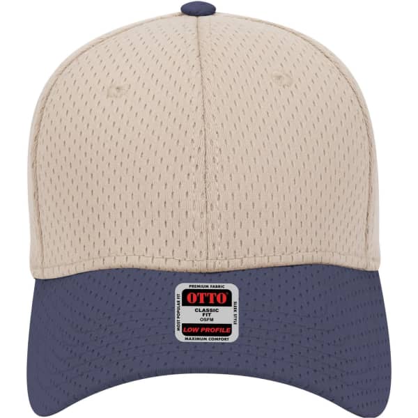 A low profile baseball cap in beige with a navy peak and a logo on the front.