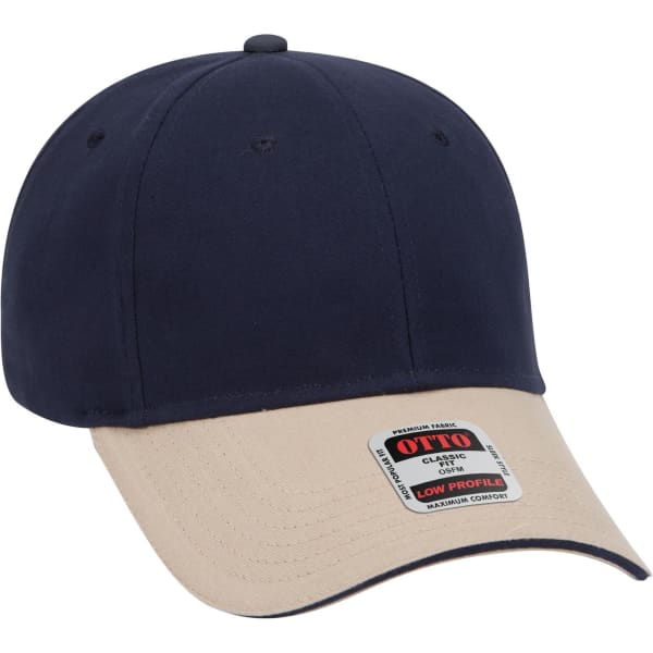 A navy and beige low profile baseball cap featuring a branded label on the side.