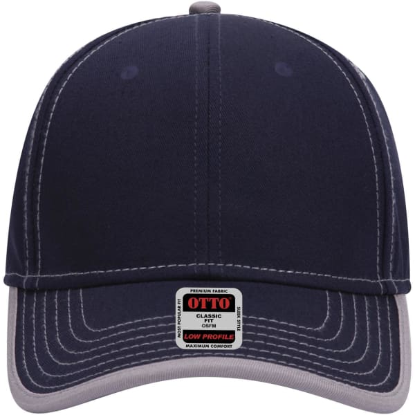 A low-profile baseball cap in navy blue with a light grey brim and an attached brand tag.