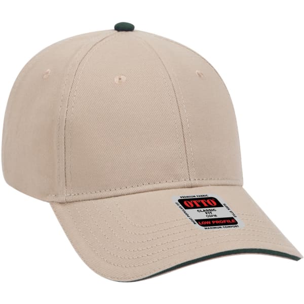 A beige low profile baseball cap with a green peak and a logo on the side.