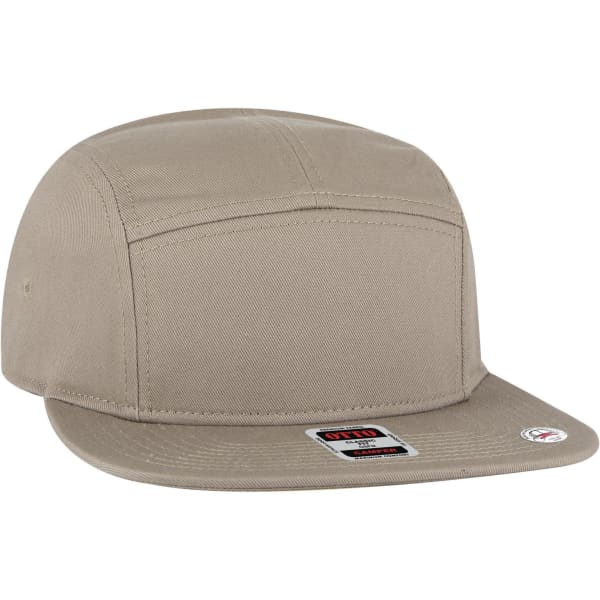 A beige 5 panel camper hat with a flat brim and a logo on the side. The design is simple and modern.