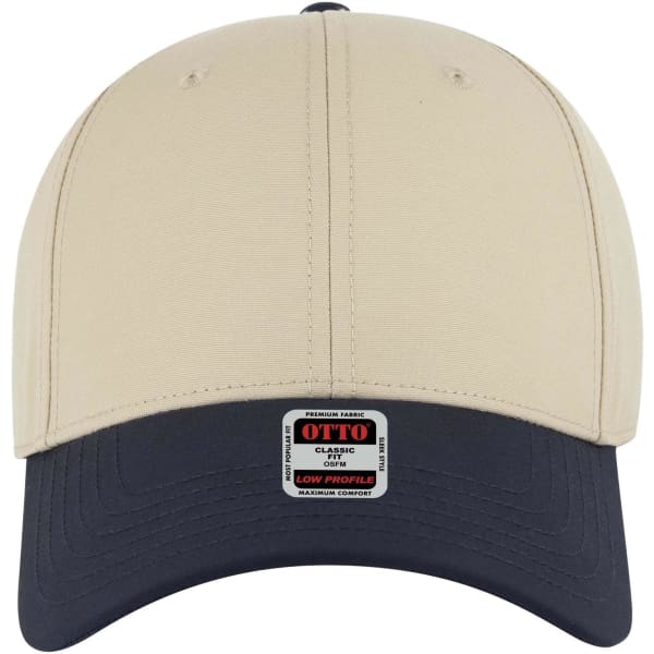 A beige and navy 6 panel low profile baseball cap featuring a logo on the front.