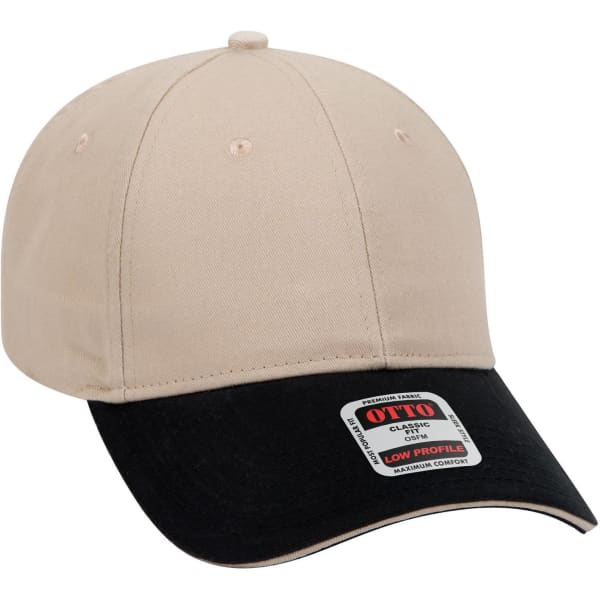 A beige and black 6 panel low profile baseball cap featuring a brand label on the side.