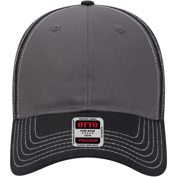 A grey six-panel low profile trucker cap with a black visor and a branded label on the front.