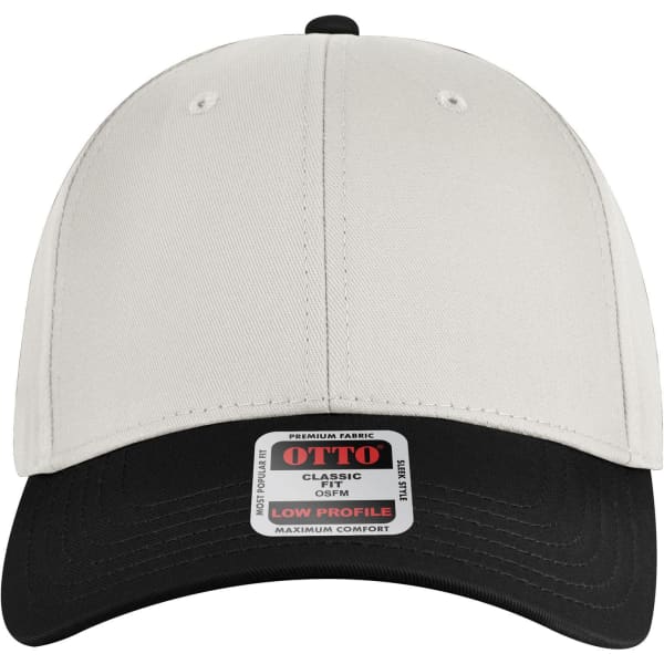 A low profile baseball cap in cream with a black peak and a logo on the front label.