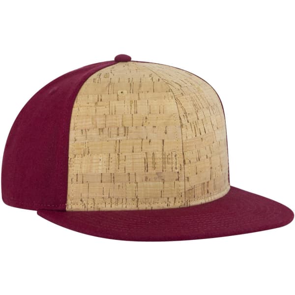 A snapback cap featuring a cork front and a burgundy fabric brim and sides. It includes a logo.