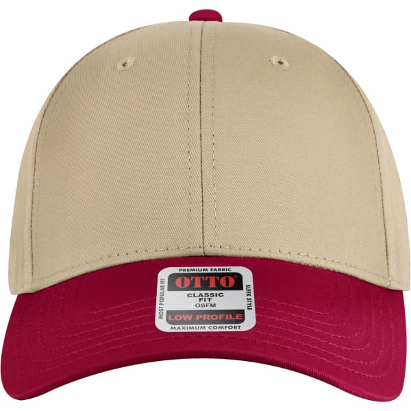 A low-profile baseball cap in beige with a red visor, featuring a logo on the front.