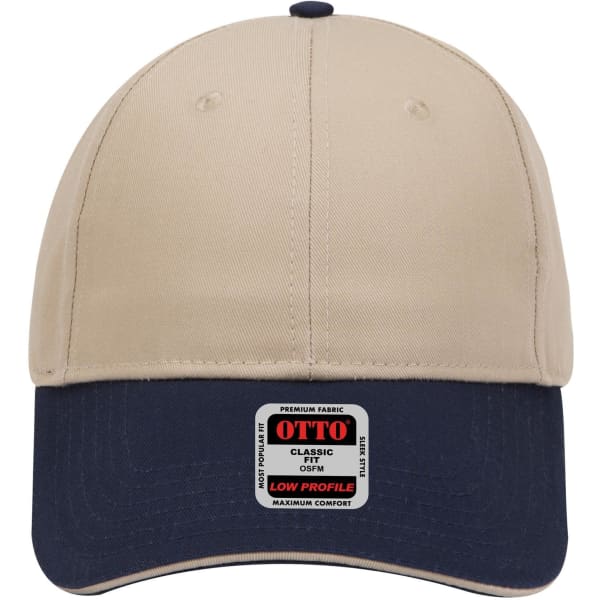 A beige and navy six-panel low profile baseball cap with a logo on the front.
