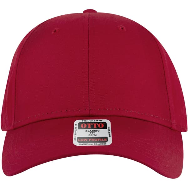 A red 6 panel low profile baseball cap with a branded label on the front.