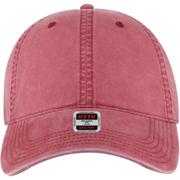 A low profile style dad cap in a faded rose colour with a front logo patch and decorative stitching.