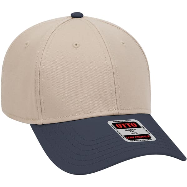 A low profile baseball cap featuring a beige crown and a navy blue brim, with a branding label on the side.
