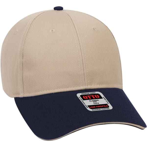 A beige and navy 6 panel low profile baseball cap with a logo on the front.