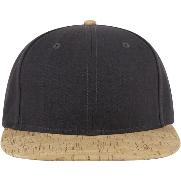 A cap with a flat brim featuring a dark fabric upper and a light cork-patterned peak, complete with a logo.